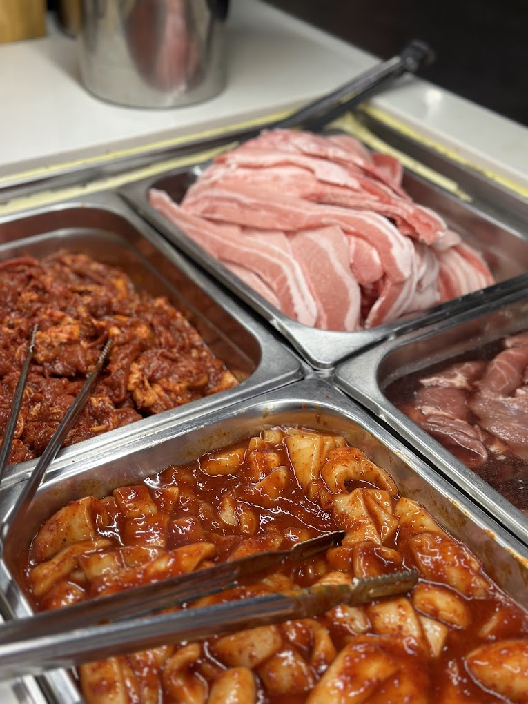 Marinated beef lifted with chopsticks